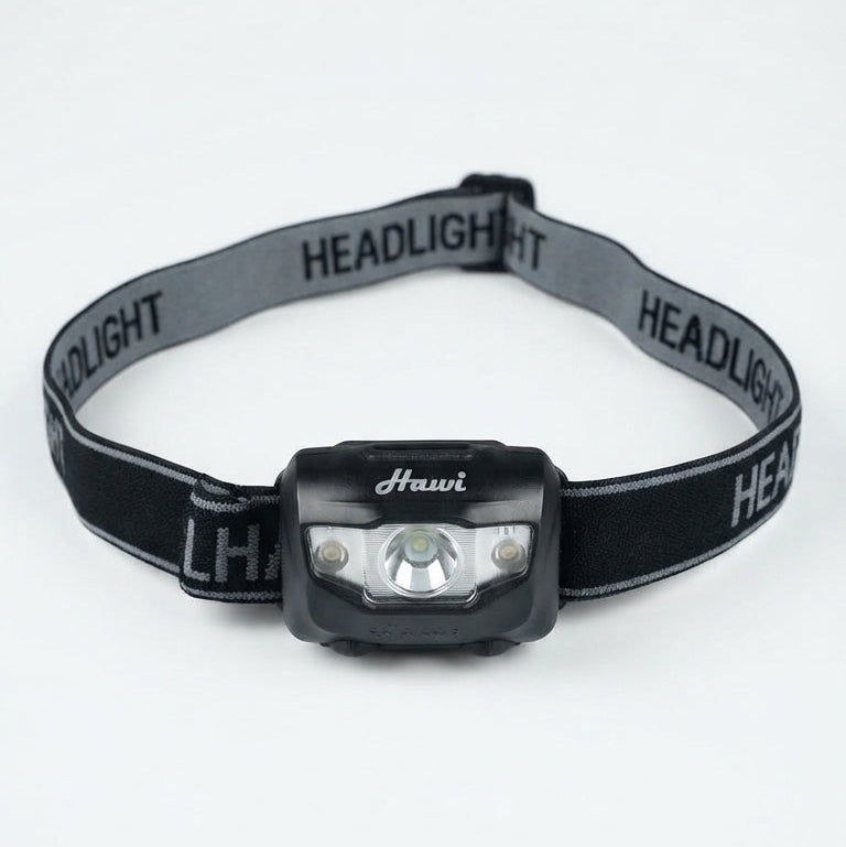 A black and gray headlight with an adjustable elastic strap, featuring the brand name 'Hauvi' printed on the front of the light housing and 'HEADLIGHT' repeated on the strap.
