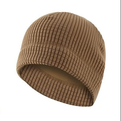 A tan waffle-knit balaclava face mask shown in multiple views on a white background, including a large front view with a flame graphic over the lower portion, a smaller top-down view, and a folded view separated by a plus sign.