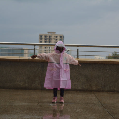 Girl standing on a rooftop with a cityscape in the background