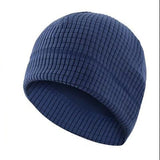 A dark blue waffle-knit balaclava face mask set shown on a white background, with two views of the hat and a folded neck gaiter, plus a flame graphic over the mask area to suggest warmth.