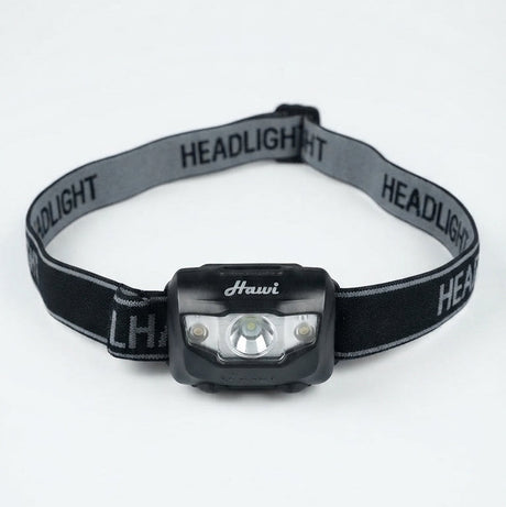 A black and gray headlight with an adjustable elastic strap, featuring the brand name 'Hauvi' printed on the front of the light housing and 'HEADLIGHT' repeated on the strap.