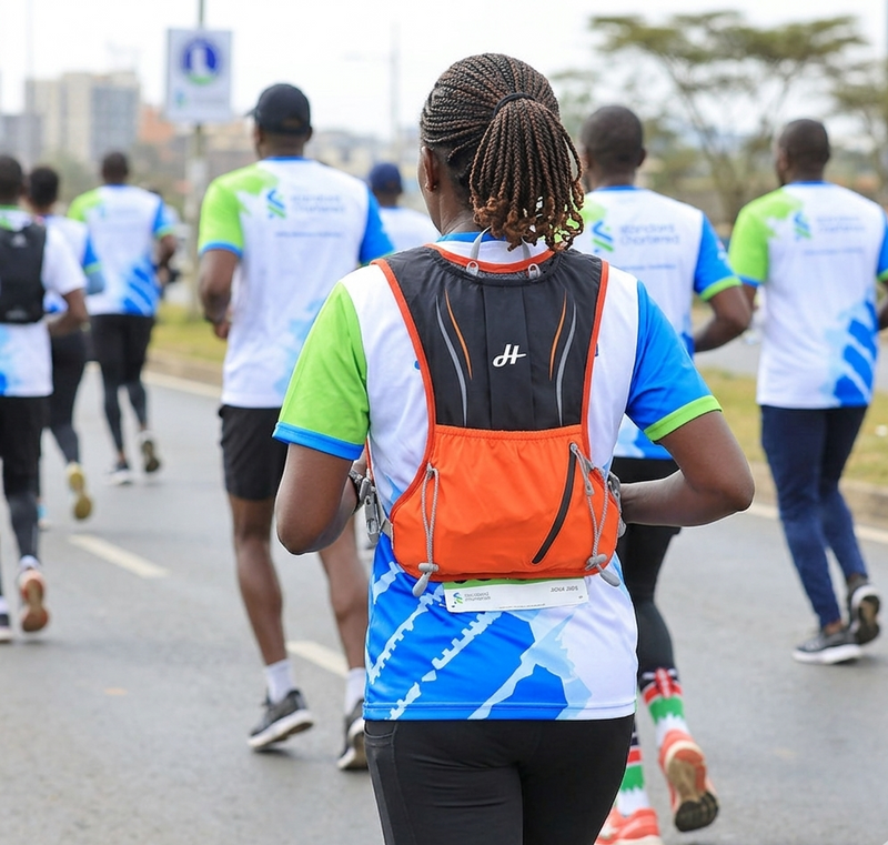 Person running with a backpack in a race setting